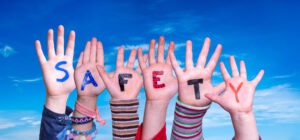 Children Hands Building Word Safety against aBlue Sky
